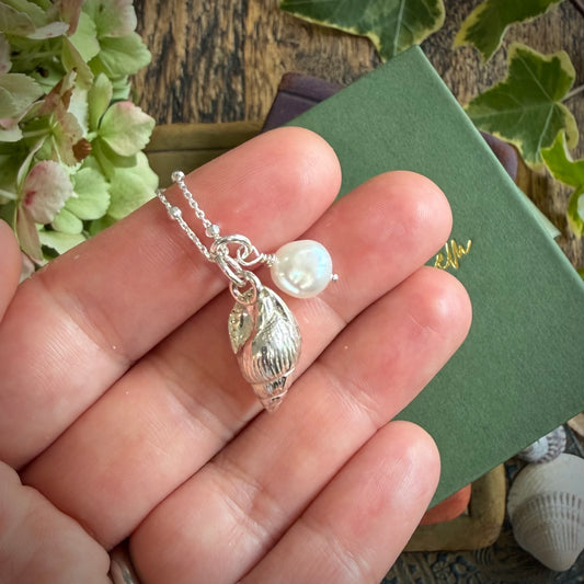 Solid silver whelk shell with keishi pearl