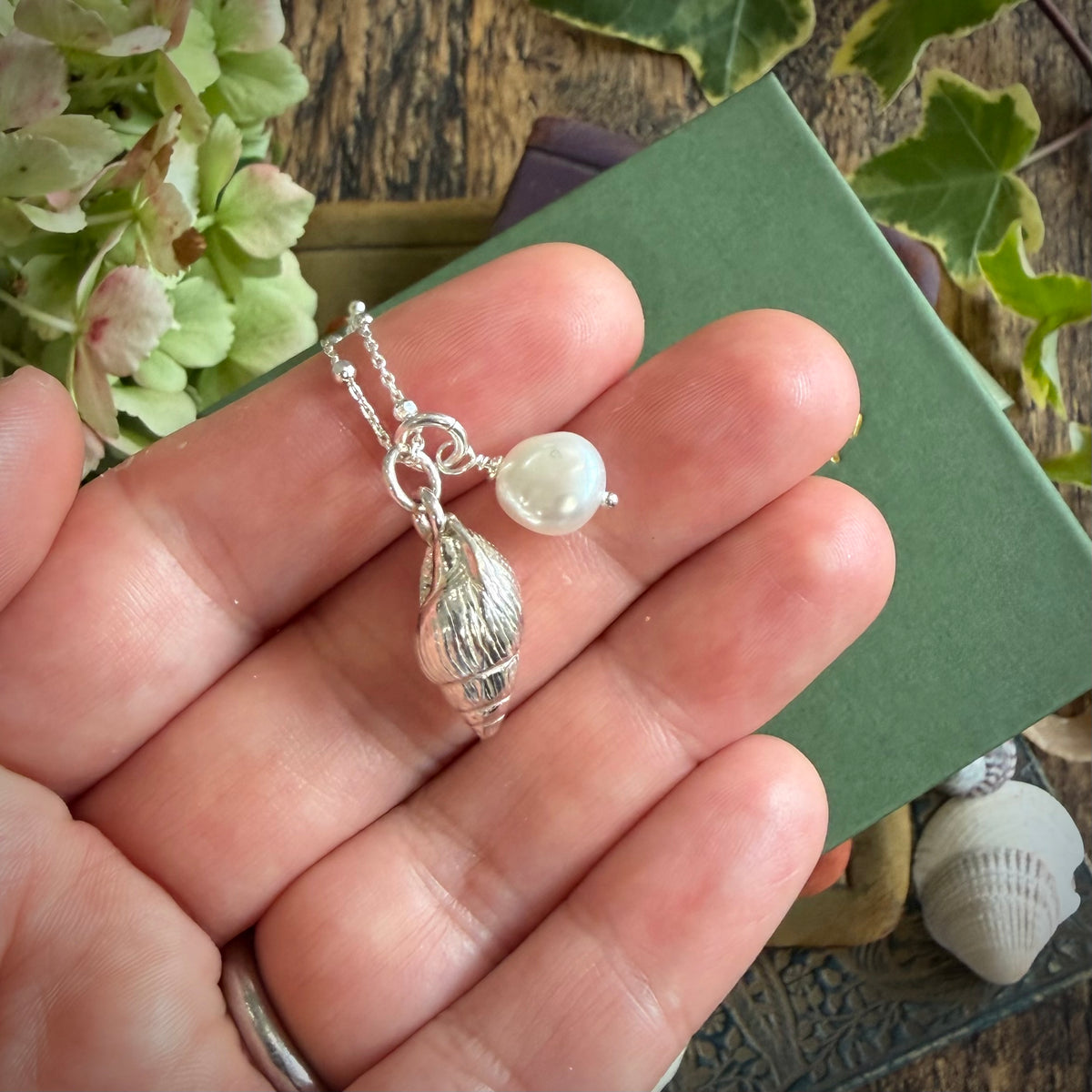 Solid silver whelk shell with keishi pearl